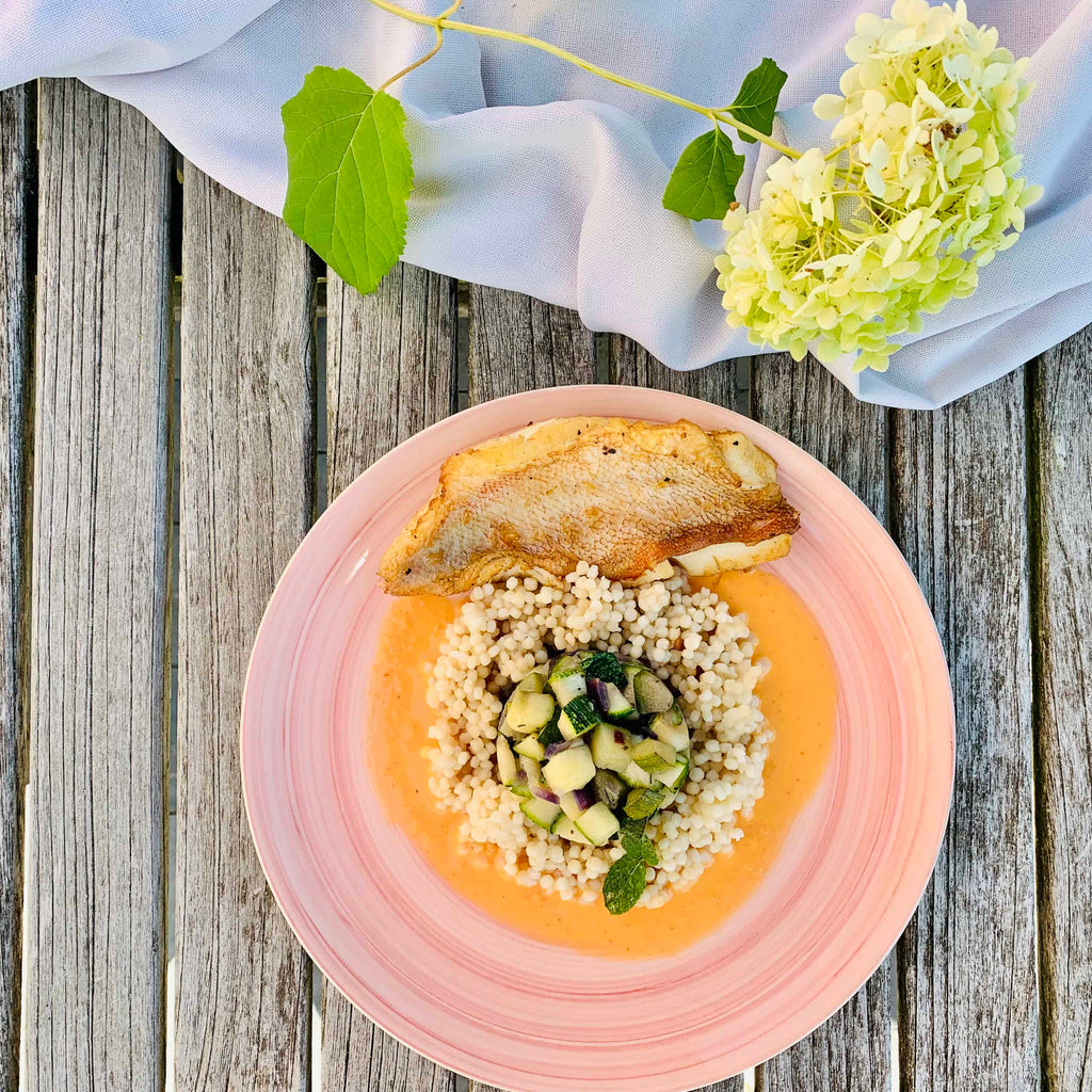 RECIPE: Zucchini with redfish, bell pepper coconut sauce and pearl couscous